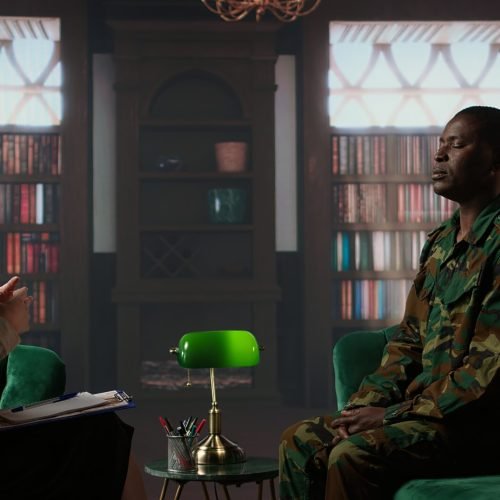 Woman therapist helping war veteran with exercises to treat traumatic depression, soldier opening up about horror combat scenes lived by his company. Psychotherapy session with counselor. Camera A.